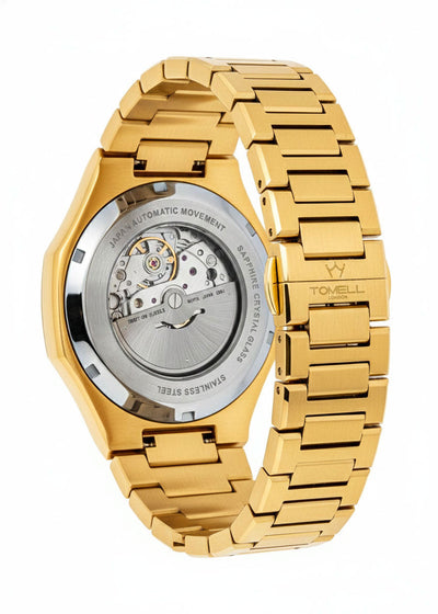 Gold watch with visible mechanical components on a white background