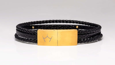 Luxury men's jewellery: Gold magnetic clasp on a top-grain leather bracelet for a sharp look.