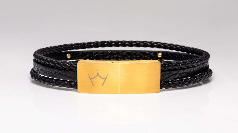Luxury men's jewellery: Gold magnetic clasp on a top-grain leather bracelet for a sharp look.