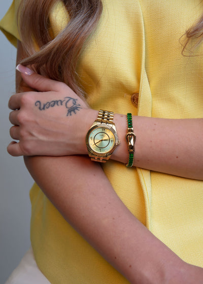 View of the gold strap/bracelet detailing and secure butterfly clasp mechanism