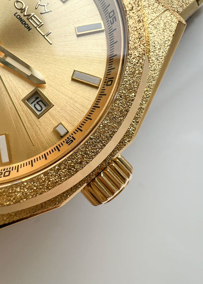 Gold watch with Tomell London branding 