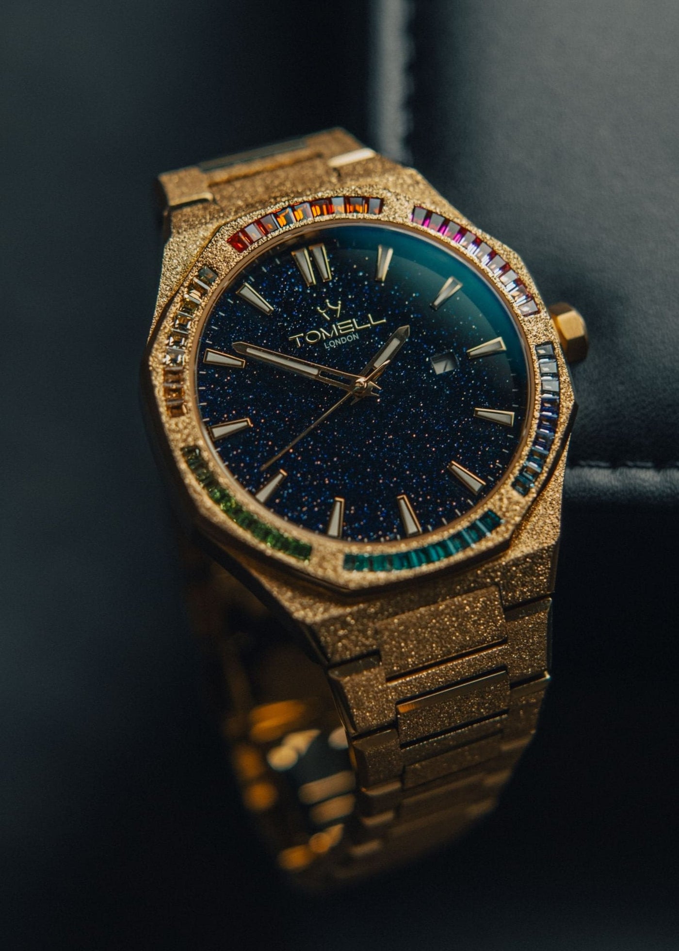 Gold watch with gemstone accents with blue stardust dial 