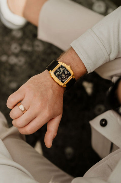 Gold watch on a wrist skeleton