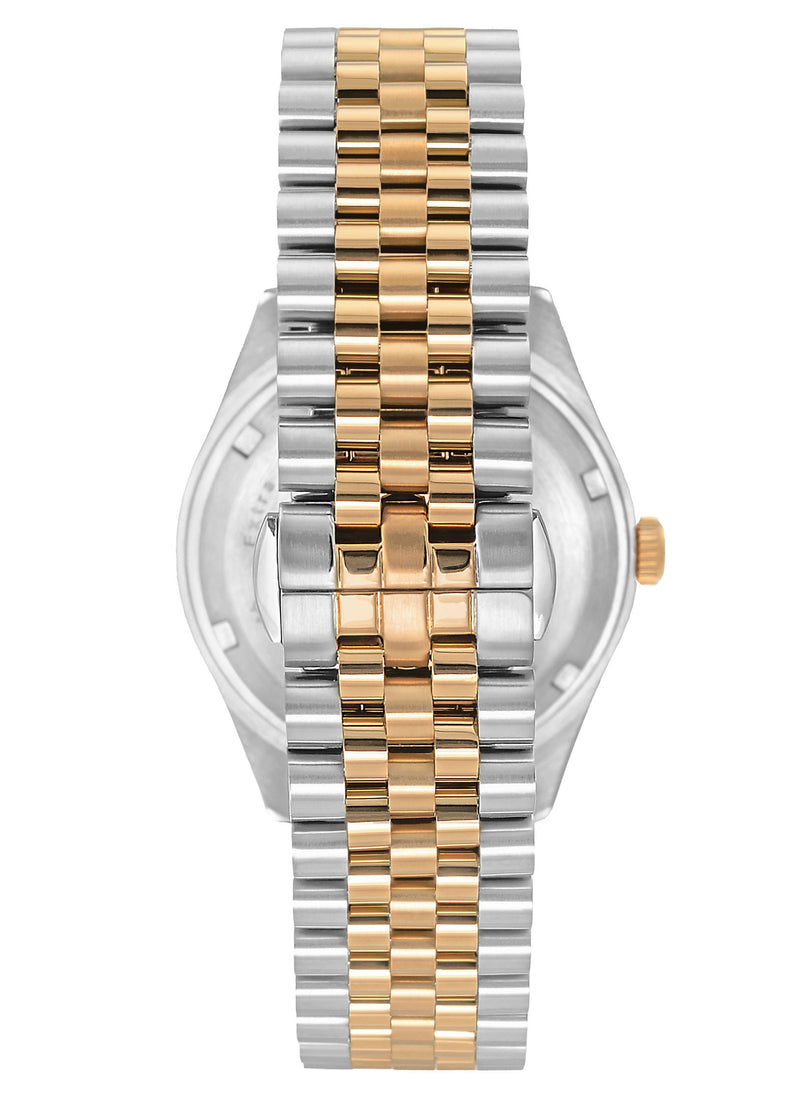 The two-tone watch positioned next to other silver and rose gold jewellery for context.