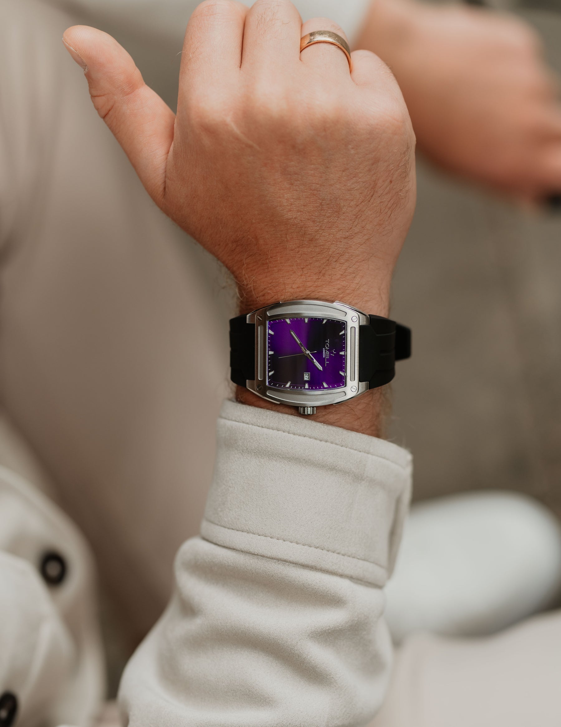 silver watch with purple dial